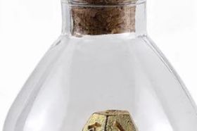 The Hymgho Unseelie Mini Metal RPG Dice Set in Gold features miniature solid metal polyhedral dice with a rich, gleaming gold finish. A luxurious compact set for players who want their dice to shine as brightly as their critical hits.