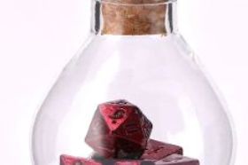 The Hymgho Unseelie Mini Metal RPG Dice Set in Red is a compact full polyhedral set cast in solid metal with a bold crimson finish. Small but fierce — perfect for players who want metal dice in a travel-friendly size.